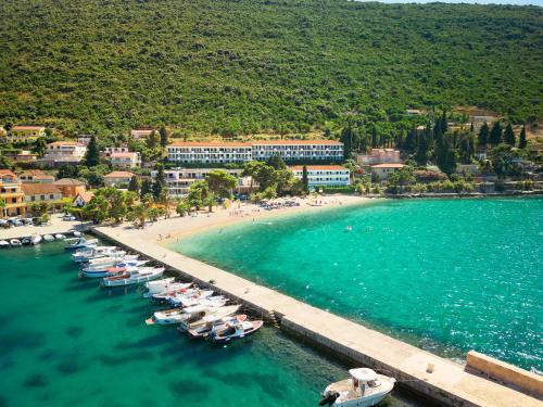 an aerial view of a beach with boats in the water at Hotel Faraon in Trpanj