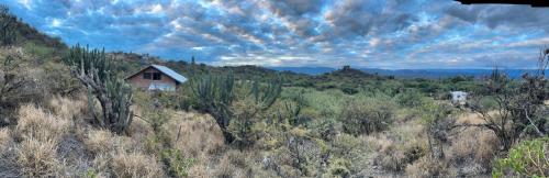 a small house in the middle of a field at Hostel Vida 