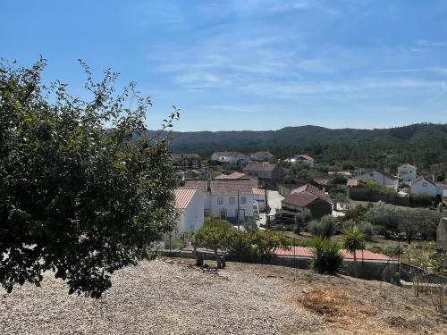 a view of a town from the top of a hill at Cottage Abrunheiro Grande in Vila de Rei