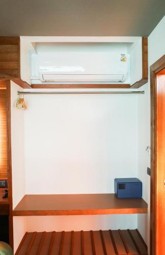a room with a heater on a shelf at Salty Pearl Phuket 1 in Patong Beach