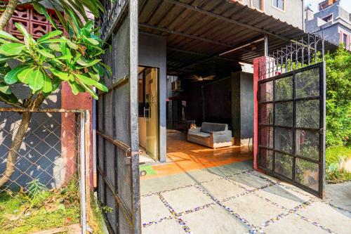 an open gate to a house with a patio at Collection O Hingna Road Near Rachana Metro Station in Nagpur