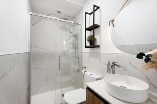 a bathroom with a shower and a sink and a toilet at Casa Tagoro Dream in Costa Del Silencio