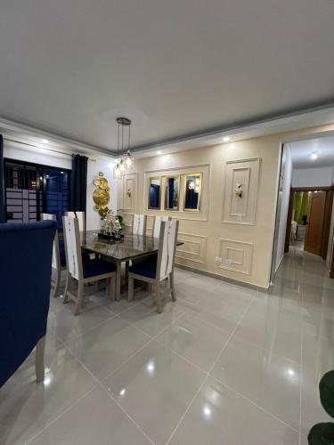 a dining room with a table and chairs at Residencial Juan Emilio 1 in San Felipe de Puerto Plata
