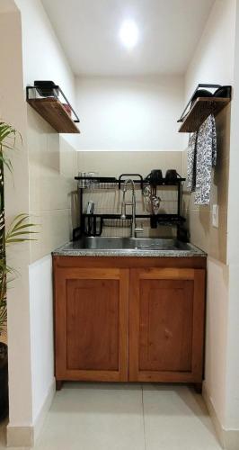 a kitchen with a sink and a counter top at Nice Apartment at the Canal in Gamboa