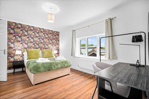 a living room with a bed and a table at Comfortable 2 Bed Apt, Sleeps 8, Parking, Great for Contractors, Families and Leisure Stays, West Midlands, near Birmingham, Edenwood Residence in Droitwich