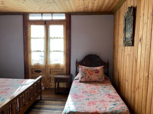 Letto o letti in una camera di Hostal Casa Rosada, Valle del Elqui