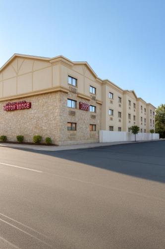 a rendering of the exterior of a hotel building at Floral Park Motor Lodge in Floral Park