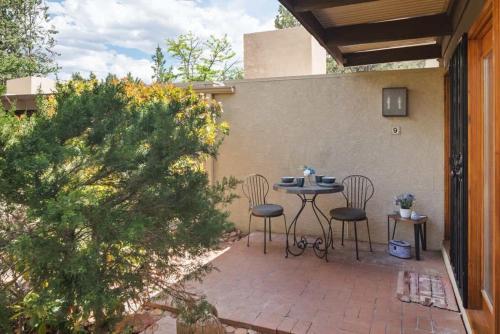 a patio with a table and chairs on a patio at Heart of Sedona Hideaway in the Desert in Sedona