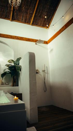 a bathroom with a sink and a toilet in a room at Love room Piccola casa, côté île in La Verpillière