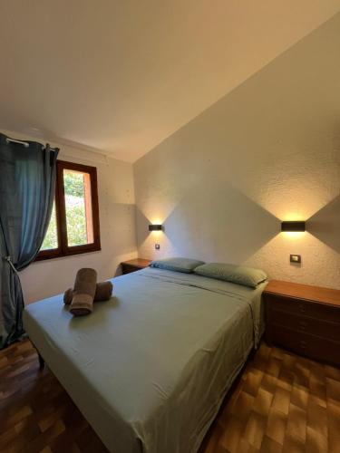 Ένα ή περισσότερα κρεβάτια σε δωμάτιο στο APPARTAMENTI BIANCANEVE by VILLA AUREA CAV