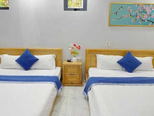 Postel nebo postele na pokoji v ubytování Ninh Giang Hotel & Apartment Vũng Tàu