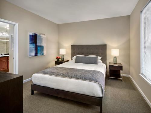 a bedroom with a large bed and two night stands at AVE Union - Furnished Apartment, Union NJ in Union