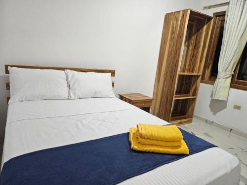 Ένα ή περισσότερα κρεβάτια σε δωμάτιο στο Cabañita del Puerto