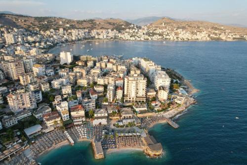 an aerial view of a city on the water at Sunset Aparthotel in Sarandë