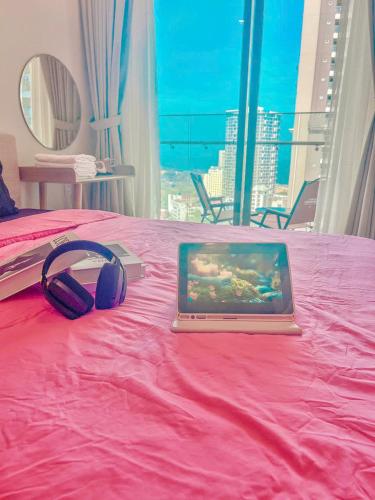 Postel nebo postele na pokoji v ubytování The Song Premium Apartment - Căn Hộ Du Lịch Biển - Anh Khoa Homestay