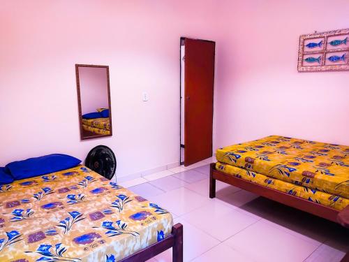 Ένα ή περισσότερα κρεβάτια σε δωμάτιο στο Casa Pérola de Paraty 02 Praia do Jabaquara