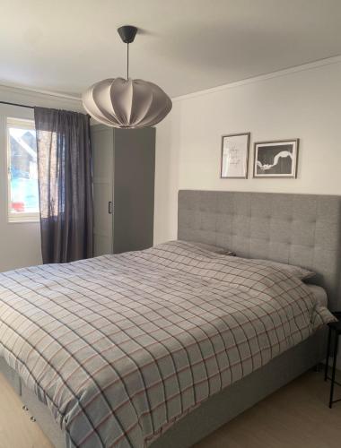 a bedroom with a bed with a plaid blanket at Sälen Vintergatan 744 Lindvallen in Sälen