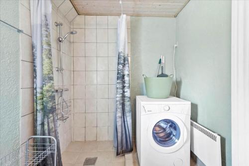 a washing machine in a bathroom with a shower at N159-Karrebaeksminde-Kirkebakken-40-B in Karrebæksminde