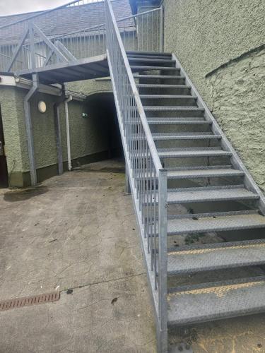 a set of stairs leading to a building at Hillfort Hostel in Baltinglass