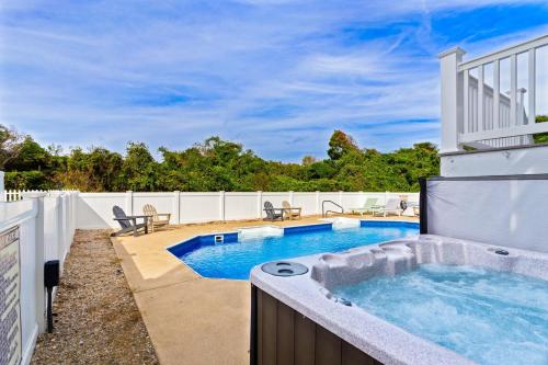 a hot tub in the backyard of a house at 3054 - Latitude Adjustment in Southern Shores