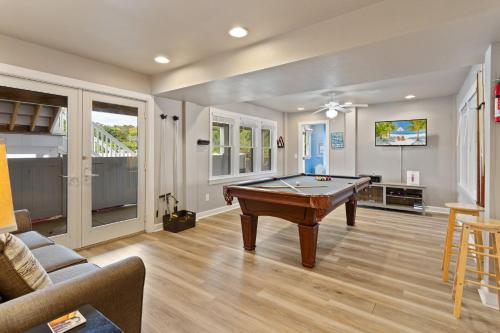 a living room with a pool table in it at 3054 - Latitude Adjustment in Southern Shores