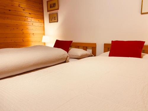 Ένα ή περισσότερα κρεβάτια σε δωμάτιο στο Apartament Loft Fiemme