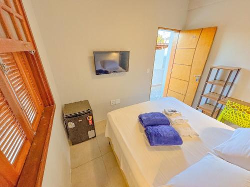 Postel nebo postele na pokoji v ubytování Edificio Barros - Suítes Exclusivas