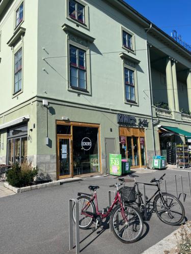 two bikes parked in front of a building at Newly renovated apartment close to city center in Oslo