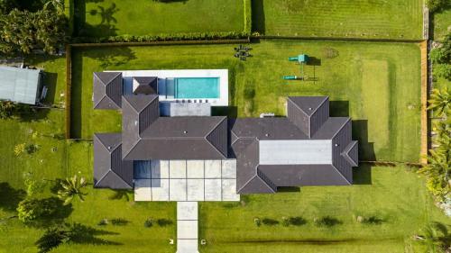 an overhead view of a house with a black roof at The Mansion One and Only Luxurios 8 000 ft Villa in Melalevca Isles