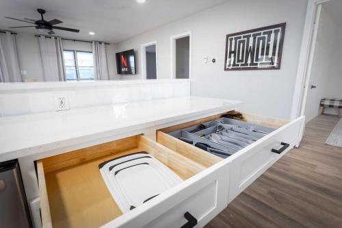 a kitchen with a white counter top with an open drawer at Mountain Top Retreat in Canyon Lake