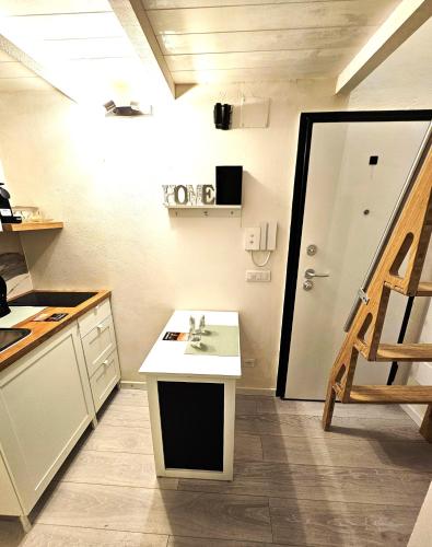 a kitchen with a counter and a sink in it at Florence Colonna Spa in Florence