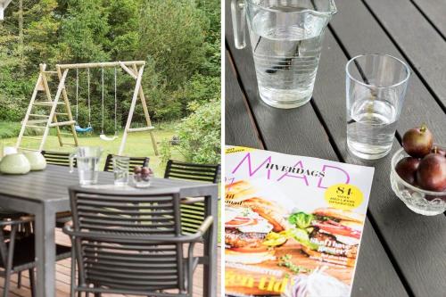 a table with a glass of water and a plate of food at JB818-Fjerritslev-Ronnevej-20 in Fjerritslev