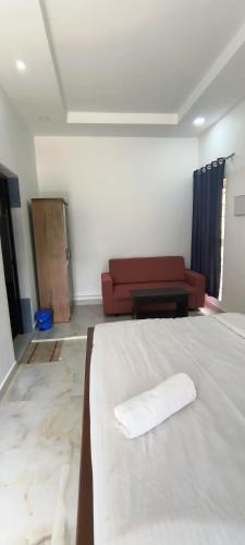 Ένα ή περισσότερα κρεβάτια σε δωμάτιο στο Blue home stay