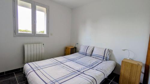 Postel nebo postele na pokoji v ubytování Maisonnette