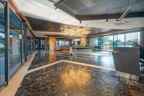 a lobby of a building with a floor of marble at Via Mar Residence - Alanya Experience in Alanya
