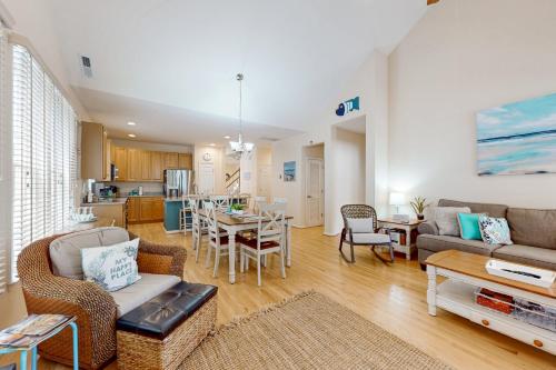a living room with a couch and a table at Bear Trap Dunes - 51 Tulip Poplar in Ocean View