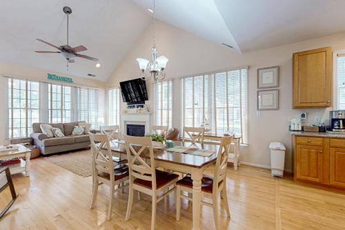 a kitchen and dining room with a table and chairs at Bear Trap Dunes - 51 Tulip Poplar in Ocean View