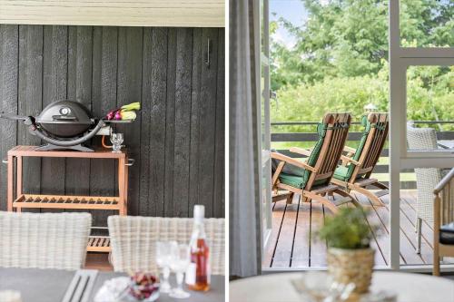a patio with chairs and a grill on a porch at JB139-Fjerritslev-Kastanievej-13 in Fjerritslev