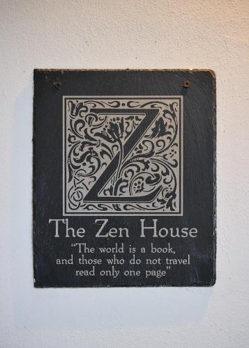 a sign with a zen house on a wall at ZEN Villa in Punta Uva