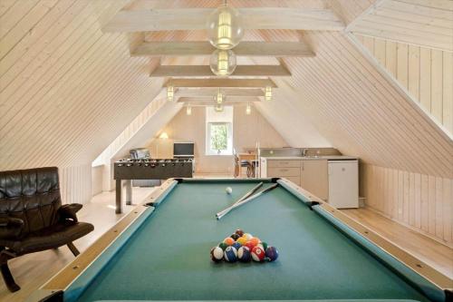 a pool table with balls on it in a room at JB186-Fjerritslev-Gyvelstien-27 in Torup Strand