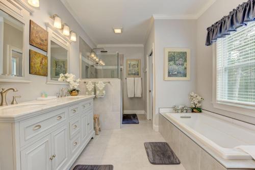 a bathroom with two sinks and a tub and a shower at The Winchester House - Serene Surroundings + Close to Downtown Jasper in West Brook