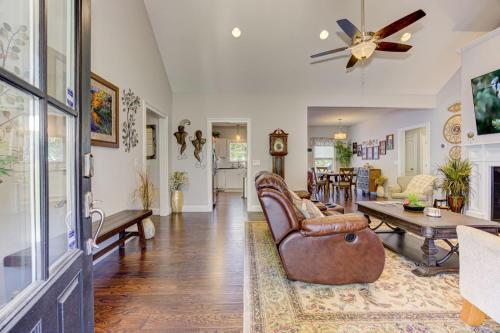 a living room with a couch and a table at The Winchester House - Serene Surroundings + Close to Downtown Jasper in West Brook