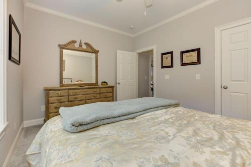a bedroom with a bed with a dresser and a mirror at The Winchester House - Serene Surroundings + Close to Downtown Jasper in West Brook