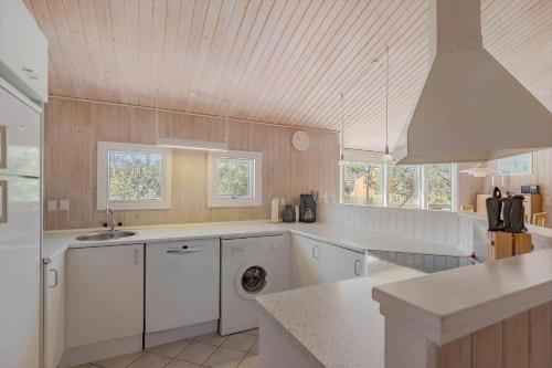 a kitchen with a sink and a dishwasher at JB293-Fjerritslev-Tyttebaerstien-24 in Torup Strand