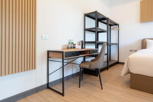 Ένα ή περισσότερα κρεβάτια σε δωμάτιο στο DC Resident Phuket