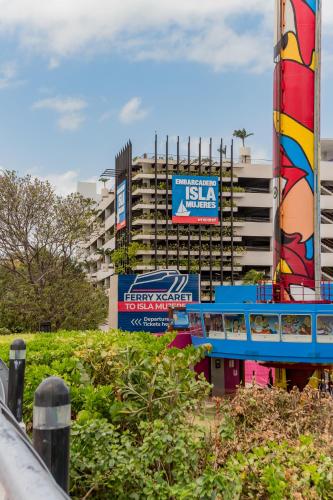 a large building with a sign in front of it at *Villa Sicilia Lagoon front by Casa Paraiso* in Cancún
