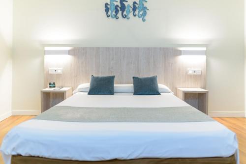 Postel nebo postele na pokoji v ubytování Hotel Alda Ribeira