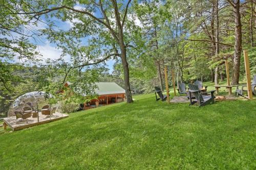 a picnic area with a gazebo in a park at 10-Acre Cabin, Sauna, Hot Tub, Game Rm, Stargazing Dome, EV, BBQ in Logan