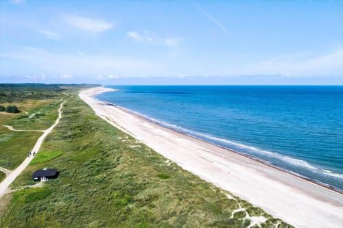 an aerial view of a beach near the ocean at JB930-Fjerritslev-Revlingestien-85 in Torup Strand