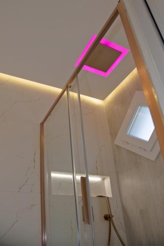 a bathroom with a skylight and a window at The Three Diamonds - B&B CESENATICO in Cesenatico